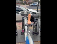 Woman shows dildo display on bike rental