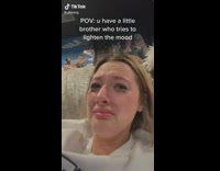 Guy doing worm in middle of room girl crying