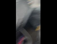 Brown car drives with hood over front window