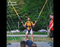 Yellow shirt guy bungee cord slingshot ride 