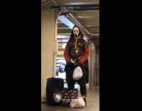 Shirtless guy moves pecs at subway station 