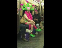 Collab Subway Creatures - Man Wears Green and Pink Flower Visor Costume Subway