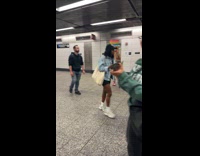 Woman wears heart costume walking at station