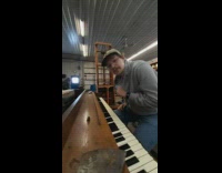 Man plays the piano with the right tune but with the wrong keys