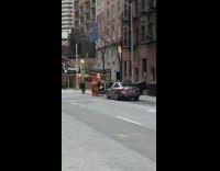 Inflatable dinosaur costume claps for healthcare workers 