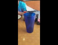 Blue cup on the table moves by itself