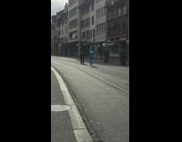 Blue jacket guy jogs in place trolley 