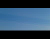 Clouds casting shadows across sky 