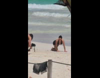 Collab IITW - Woman black bikini crawls at the beach