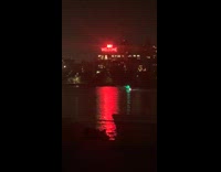 White boat blasts music flashing colorful lights 