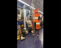 Collab Subway Creatures - Dancing man dressed as traffic barrel