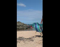 Girl pink skirt beach angry with boyfriend