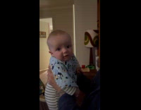 Baby stares and sticks its tongue out