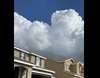Time lapse clouds on sky over house