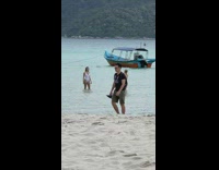 Woman in white bikini walks towards her friend Part 1