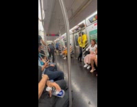 Three men dances inside the subway train
