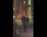 Guy wears traffic cone on head 
