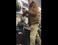 Collab Subway Creatures - Guy opens up wrinkled brown napkin, folds it and puts paper inside plastic bag on subway train