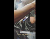 Man looks at nude images of women on his phone on the the subway 