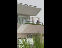 Man hold beer bottle dance on balcony