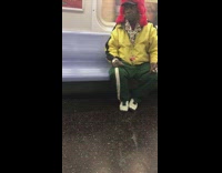 man in yellow jacket and pink red fur hat