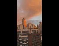 Woman captures rainbow and sunset over nyc