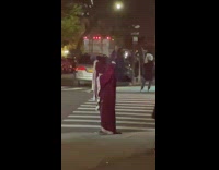 Guy in demon costume lets off steam at intersection