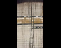 Gray muddy water leak on subway wall