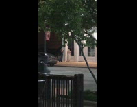 Woman in white dress sidewalk photoshoot