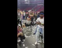 People take pictures after concert venue confetti 