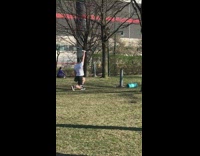 White shirt guy exercises park dumbbells 