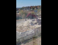 Excavator carry and break large stone slab