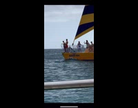 Two shirtless men on a boat recreates Titanic scene