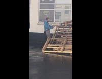 Guy apron donut on wooden crate rainy