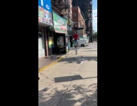 Man red shirt ride tall unicycle street