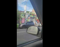 Guy walks outside while juggling three pins 