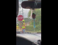 Girls in car screaming at construction worker 