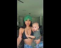 Baby asks mom for food with hand 