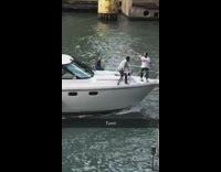 two guys white boat chicago river