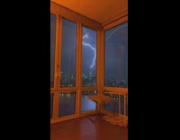 Lightning start on building tower slow motion