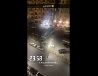 Dog sleeps on top of parked car 