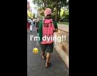 Man Wears Fart Shirt on Sidewalk 