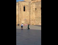 Woman green sequin dress dance park Barcelona