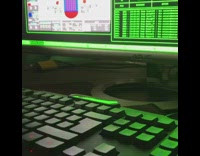 Dog hacks computer types on black keyboard 