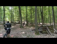 Guy rides yellow bicycle log ramp fail 