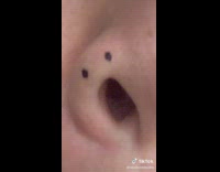 Woman makes face with nostril 