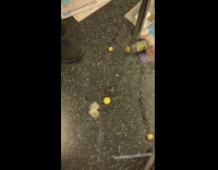 Trash, newspaper, and used condom on the floor in subway train