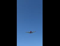 Airplane flyover prepares to land at an airport