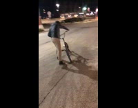 Drunk guy rides bike and falls on the ground