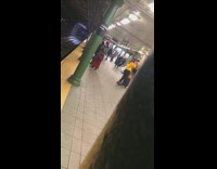 Girl in yellow sweatshirt dances in subway